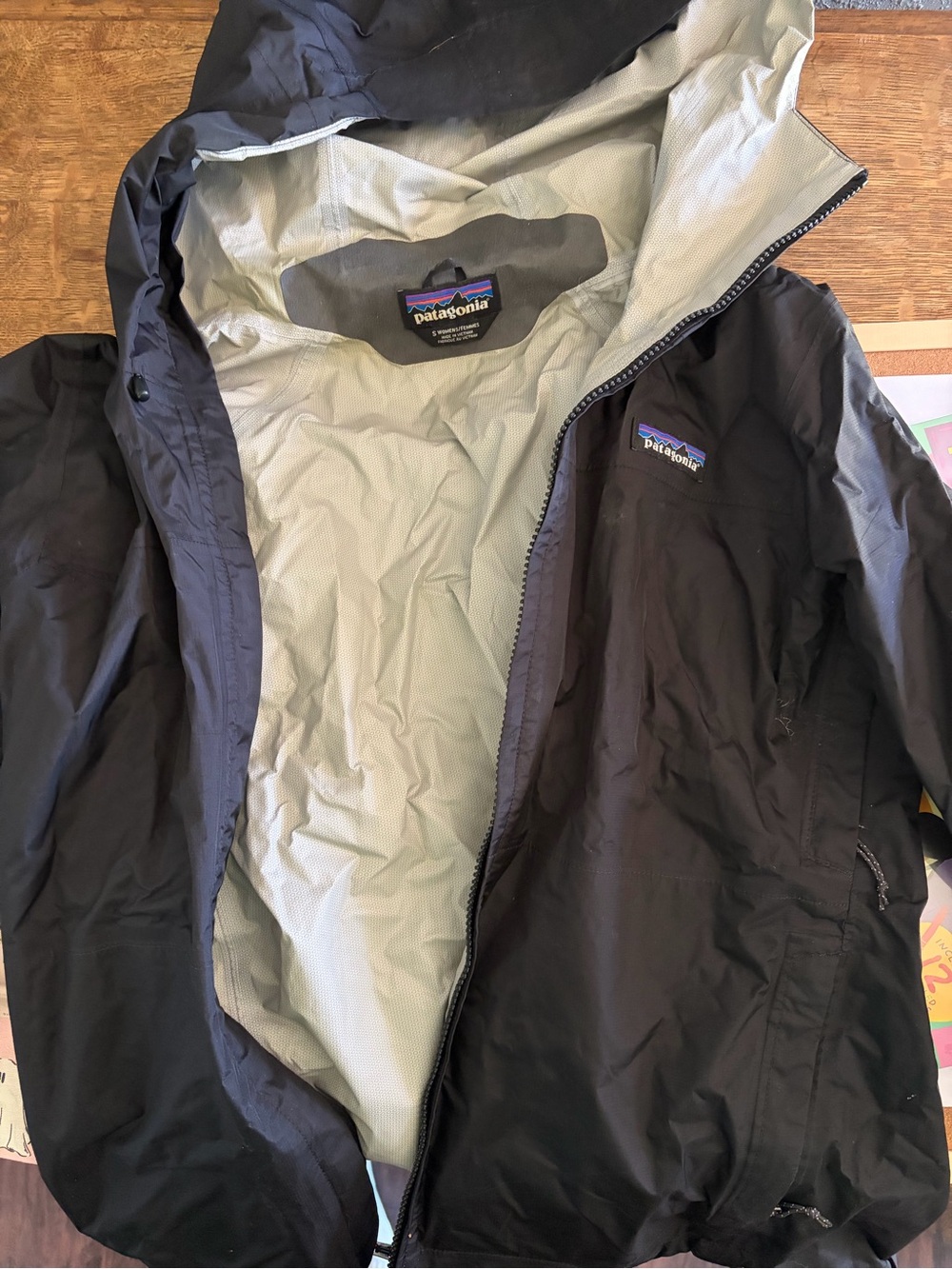 Patagonia Black Jacket with Purple and Blue Logo